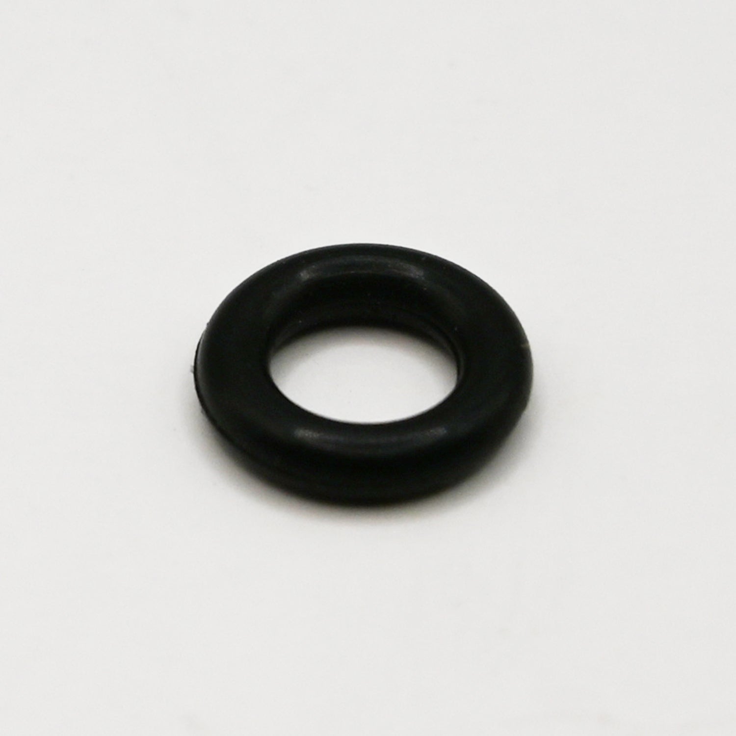 Black rubber O-Ring on white background.