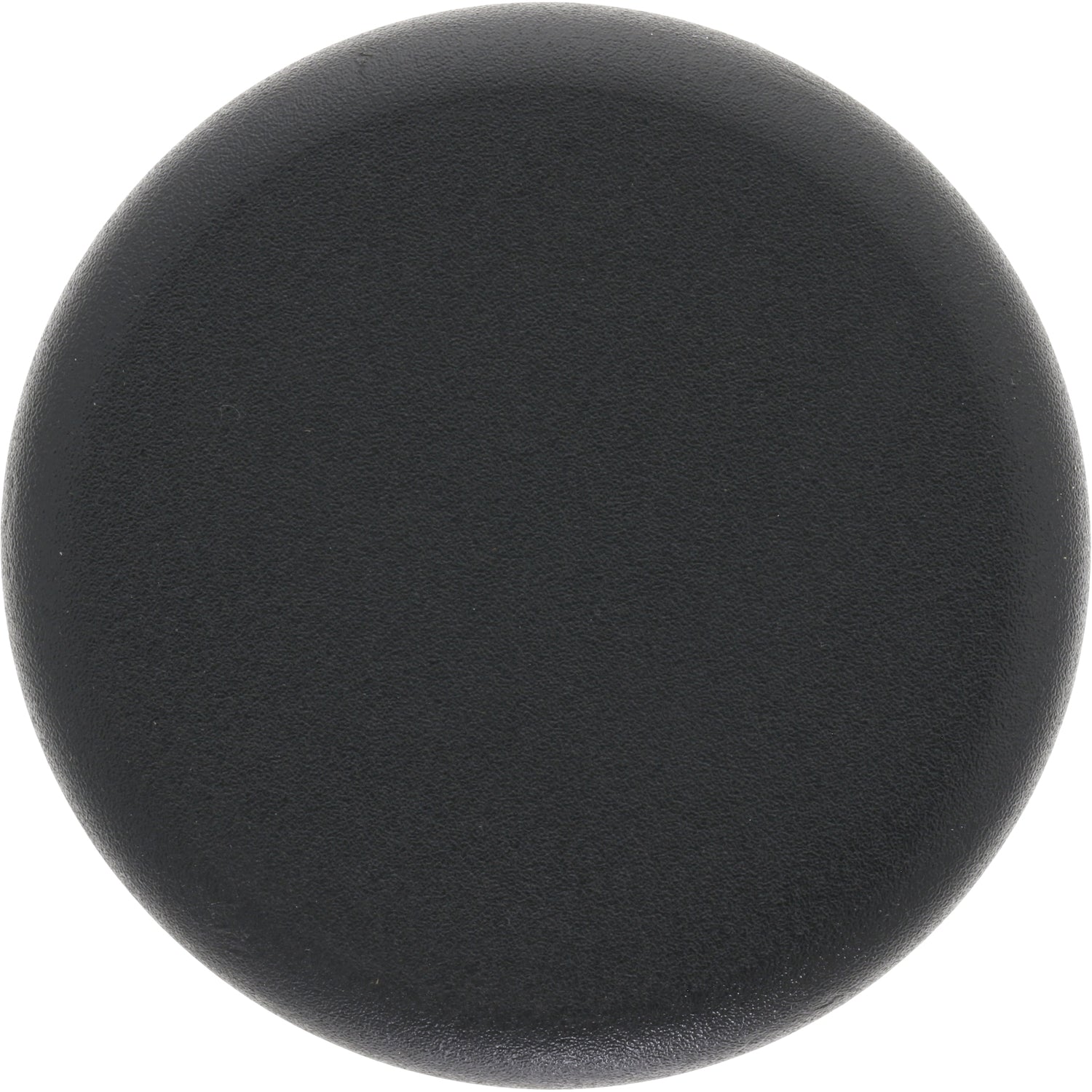 Low profile black plastic disk shaped plug on white background.