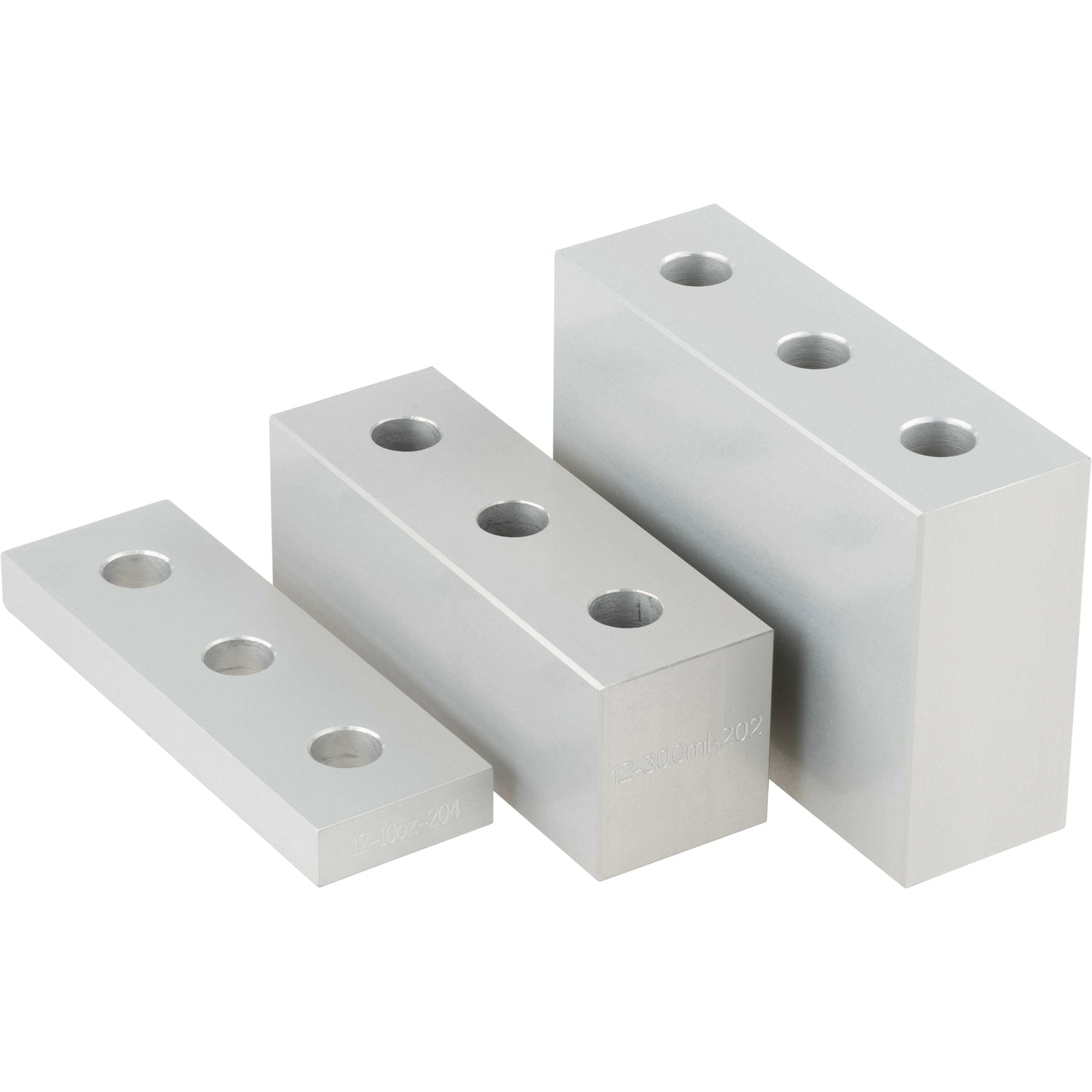 Three differently sized, grey rectangular blocks made of hard anodized aluminum. Each block as three evenly spaced through holes. Parts shown on white background.