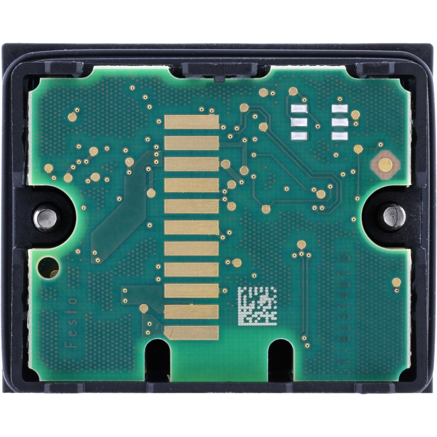 Backside of electronics module  showing green microchip on white background. 