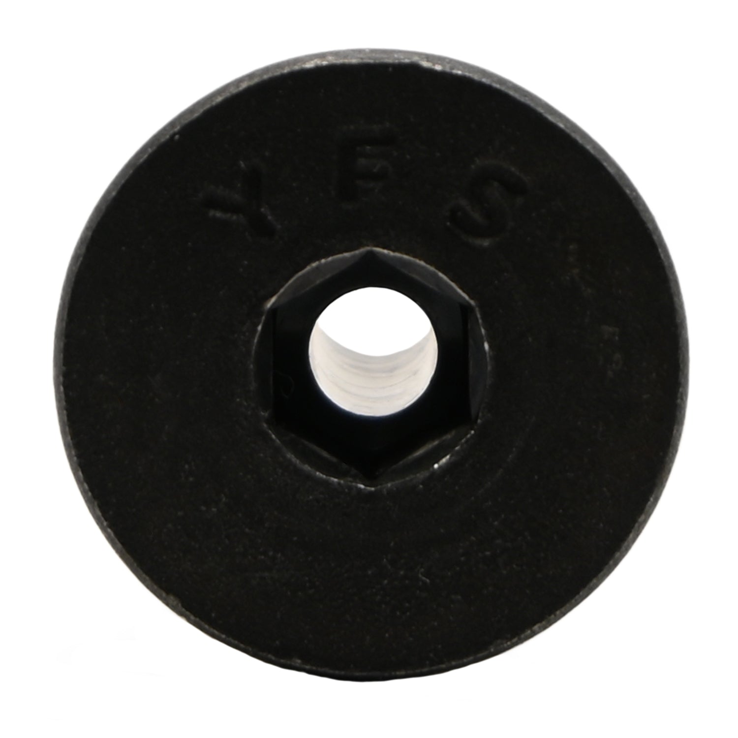 Black alloy steel flat head socket head cap screw with yellow nylon patch on white background.