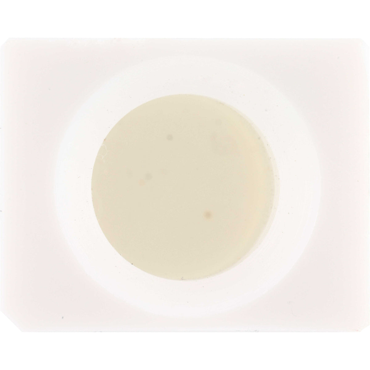 White plastic cube shaped part with center hole shown on white background. 