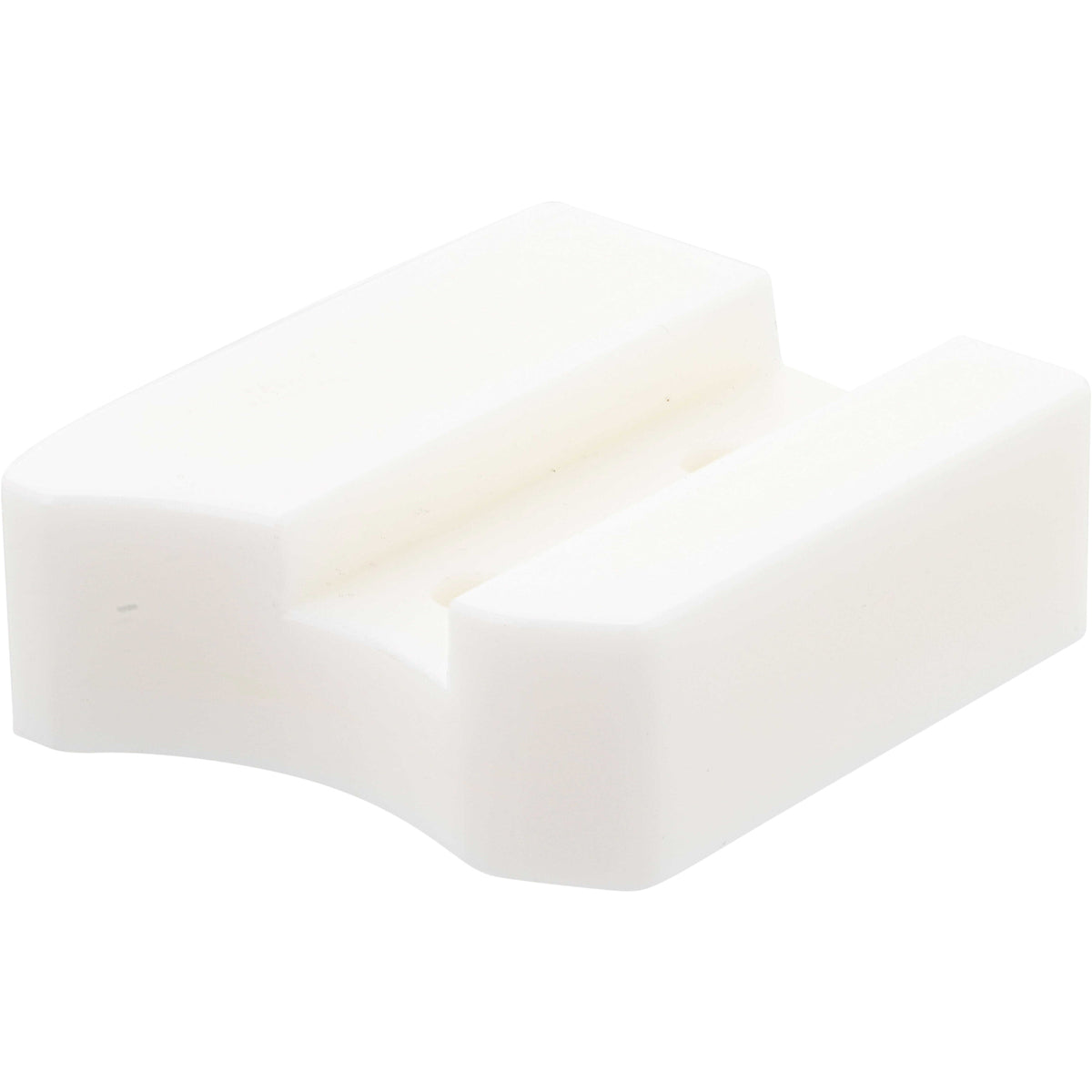 White plastic block with rounded edges and two through holes shown on white background. 