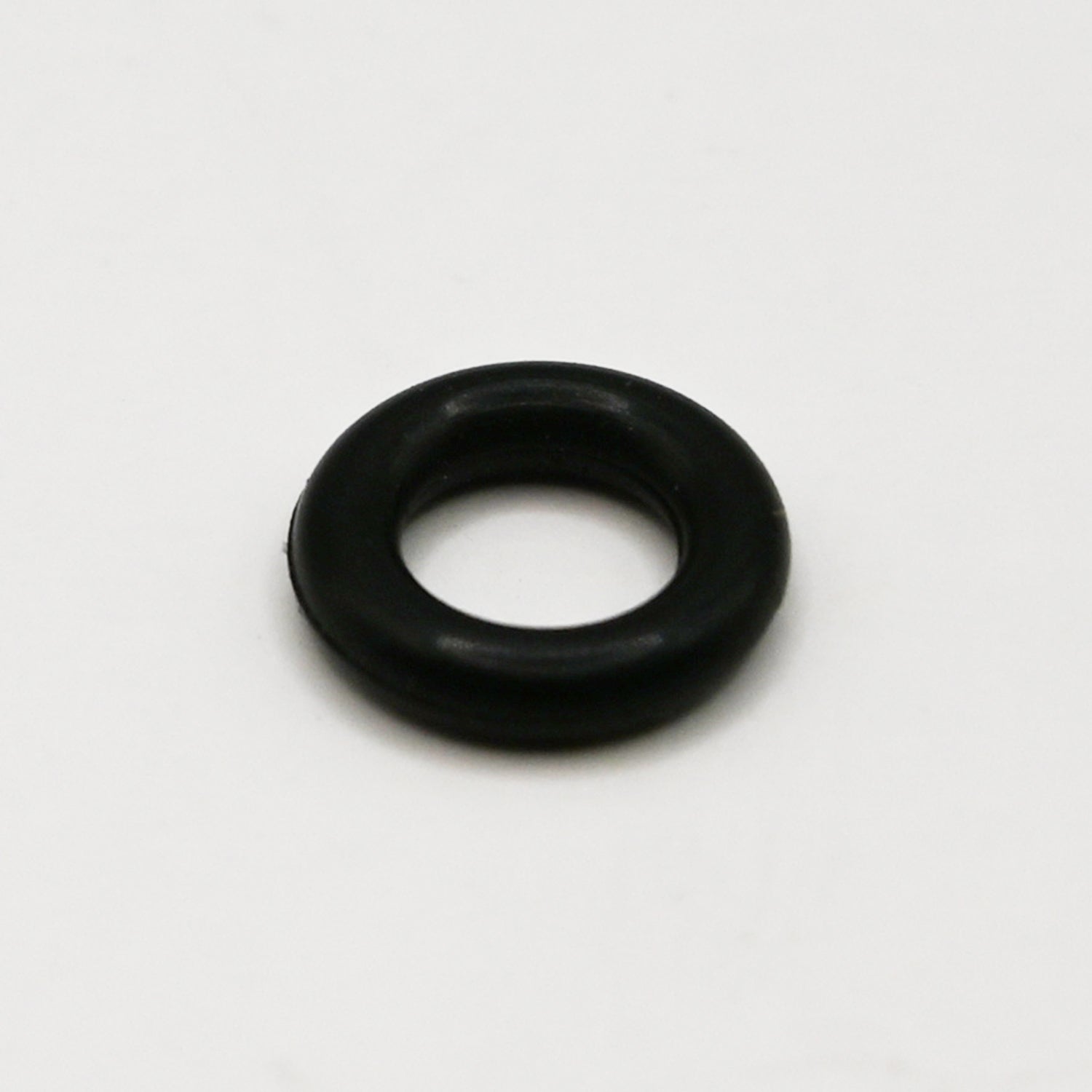 Black rubber O-Ring on white background. 