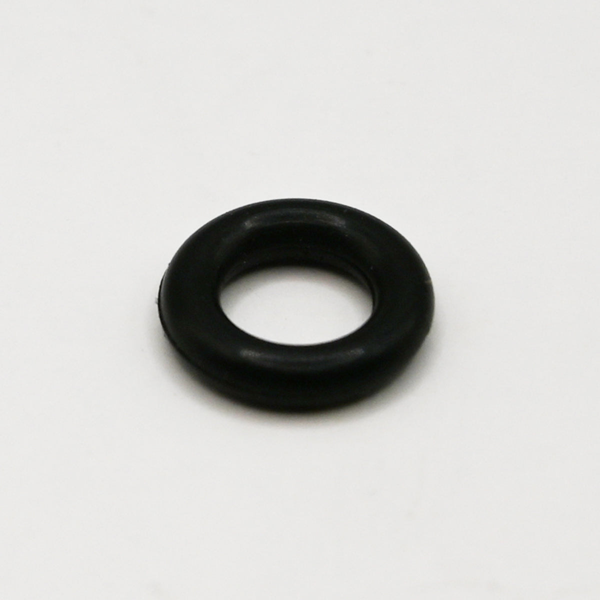 Black rubber O-Ring on white background. 