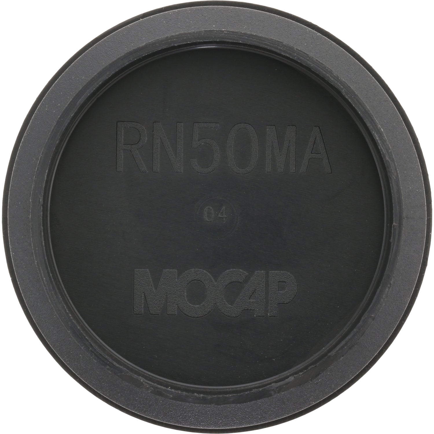 Low profile black plastic disk shaped plug on white background. 
