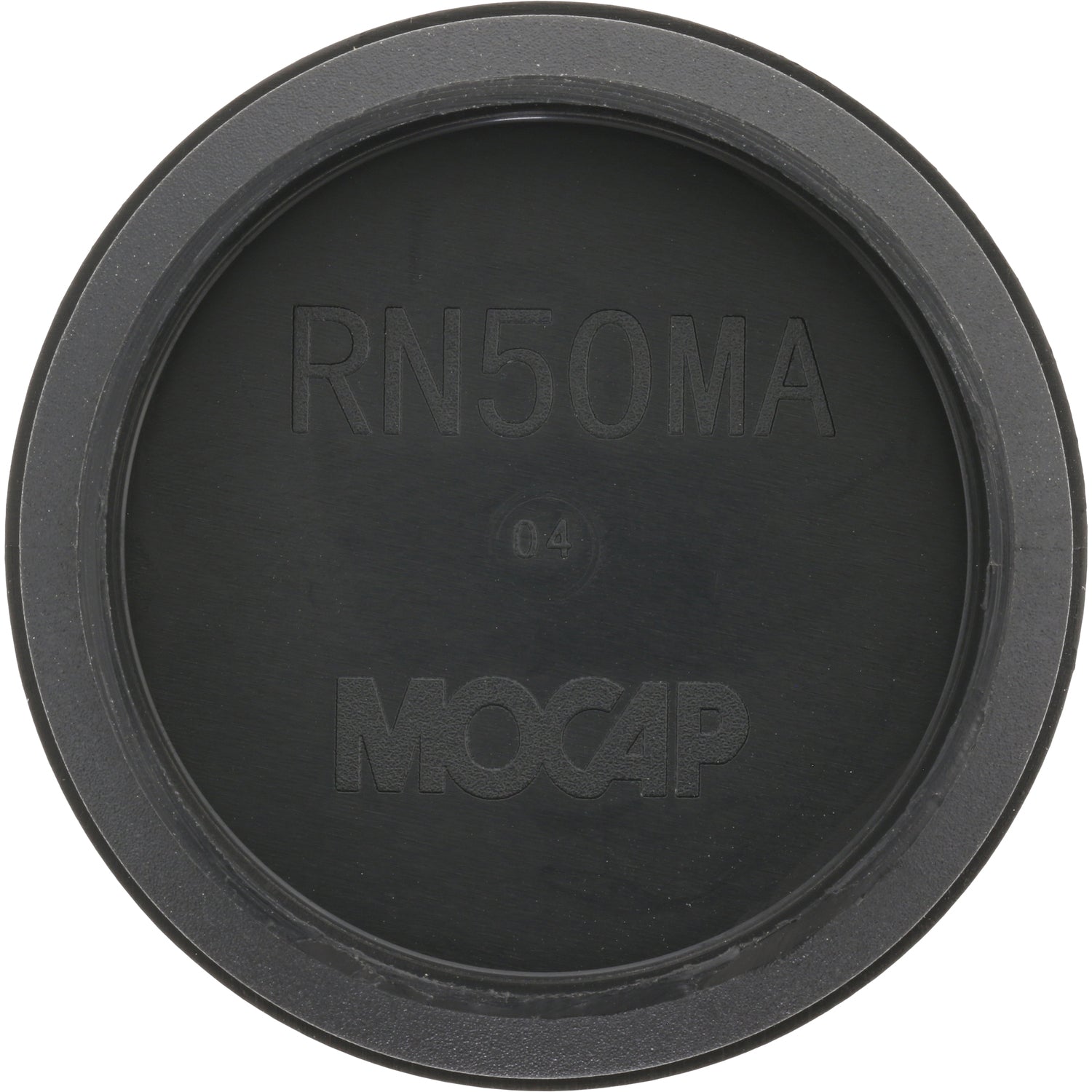 Low profile black plastic disk shaped plug on white background. 