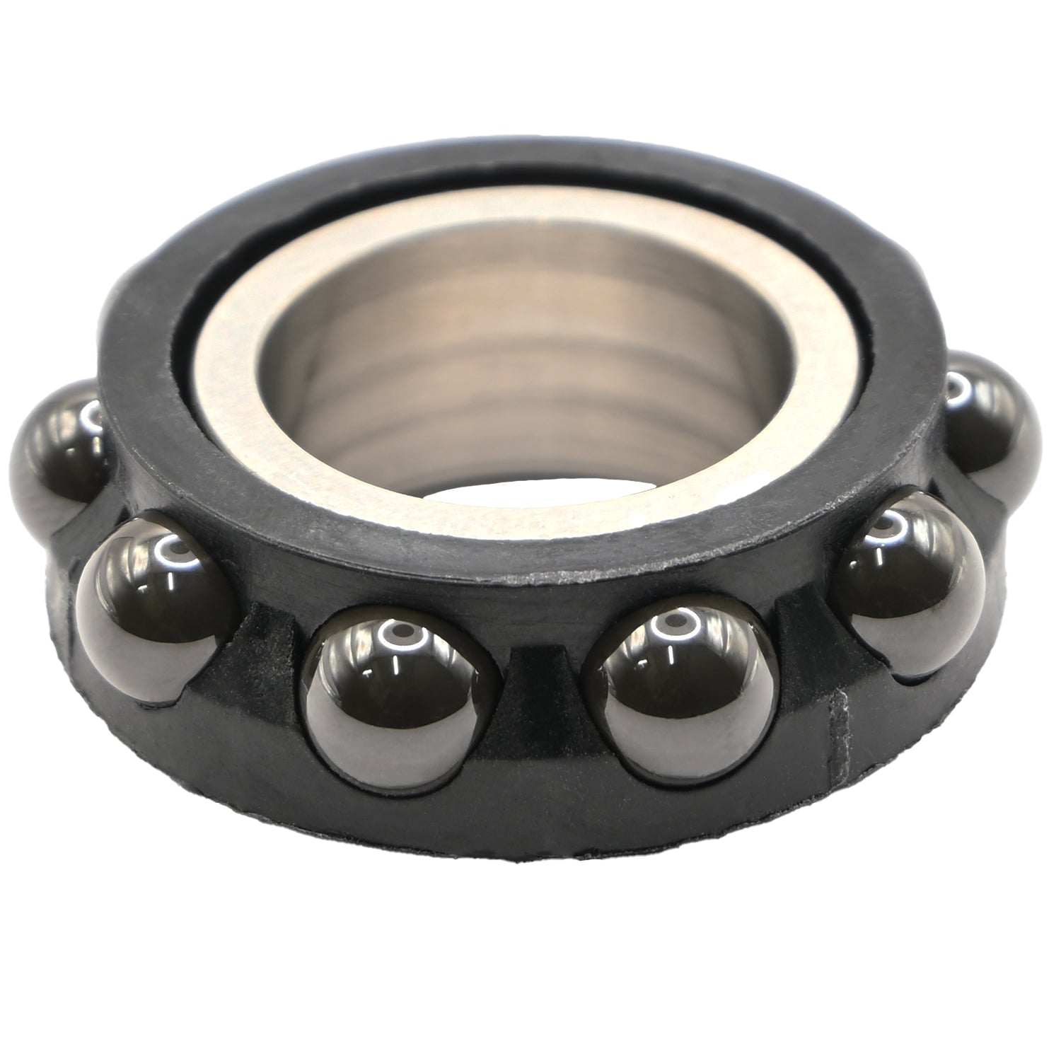 Black plastic ceramic ball bearing with stainless steel inner race on white background. 