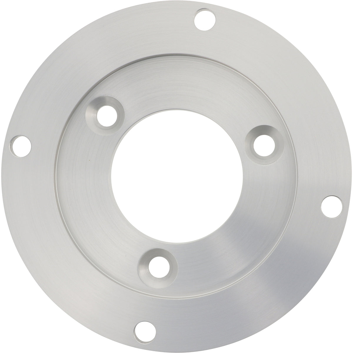 Disk shaped aluminum part with large center hole and multiple smaller mounting holes shown on white surface.