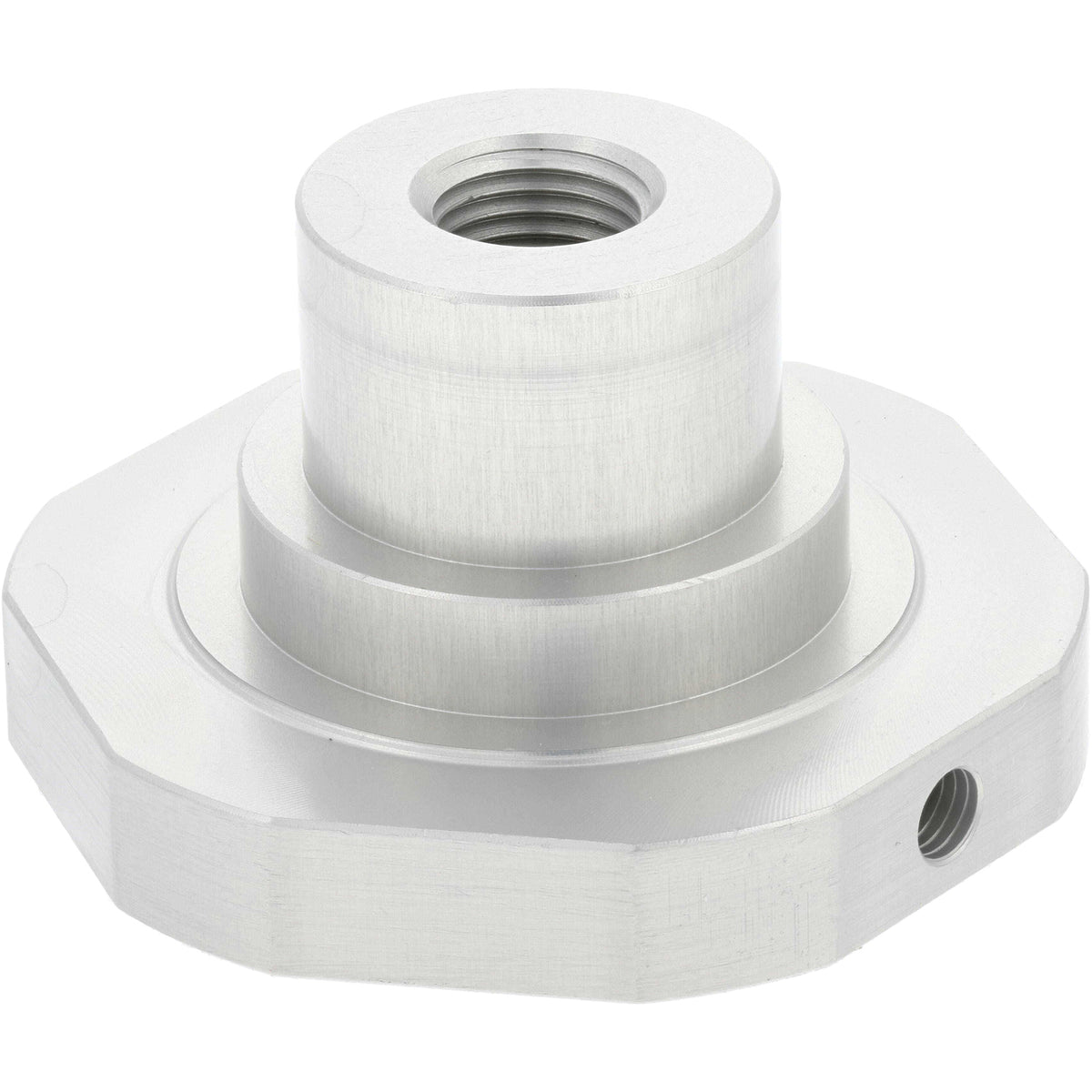 Grey aluminum machined part with cylindrical post on a decagonal base. A threaded hole passes through the center of the part and a smaller threaded is located on one of the base&#39;s flats. Part shown on white background.