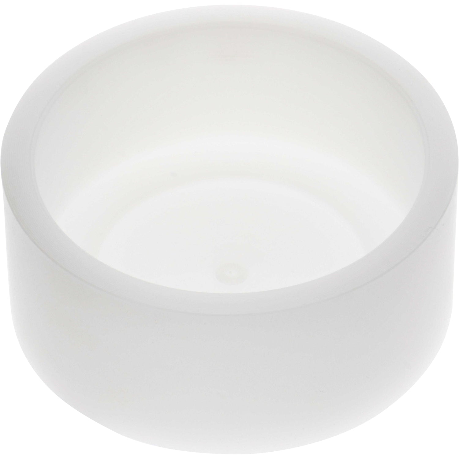 White cylindrical machined part made of Delrin plastic, shaped like a puck on white background