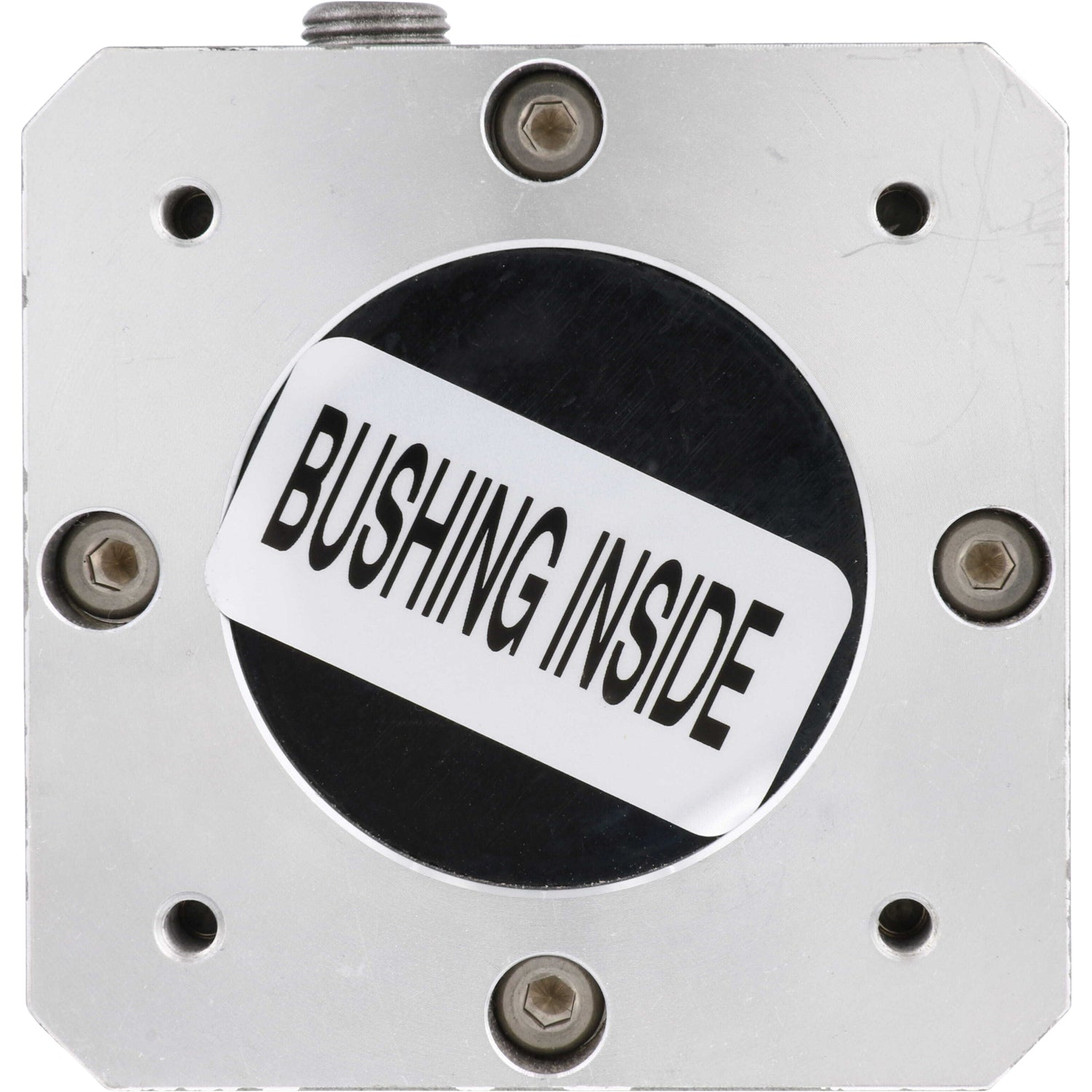 Underside of grey gearbox with white sticker with black text that reads &quot; bushing inside&quot; on white background. 