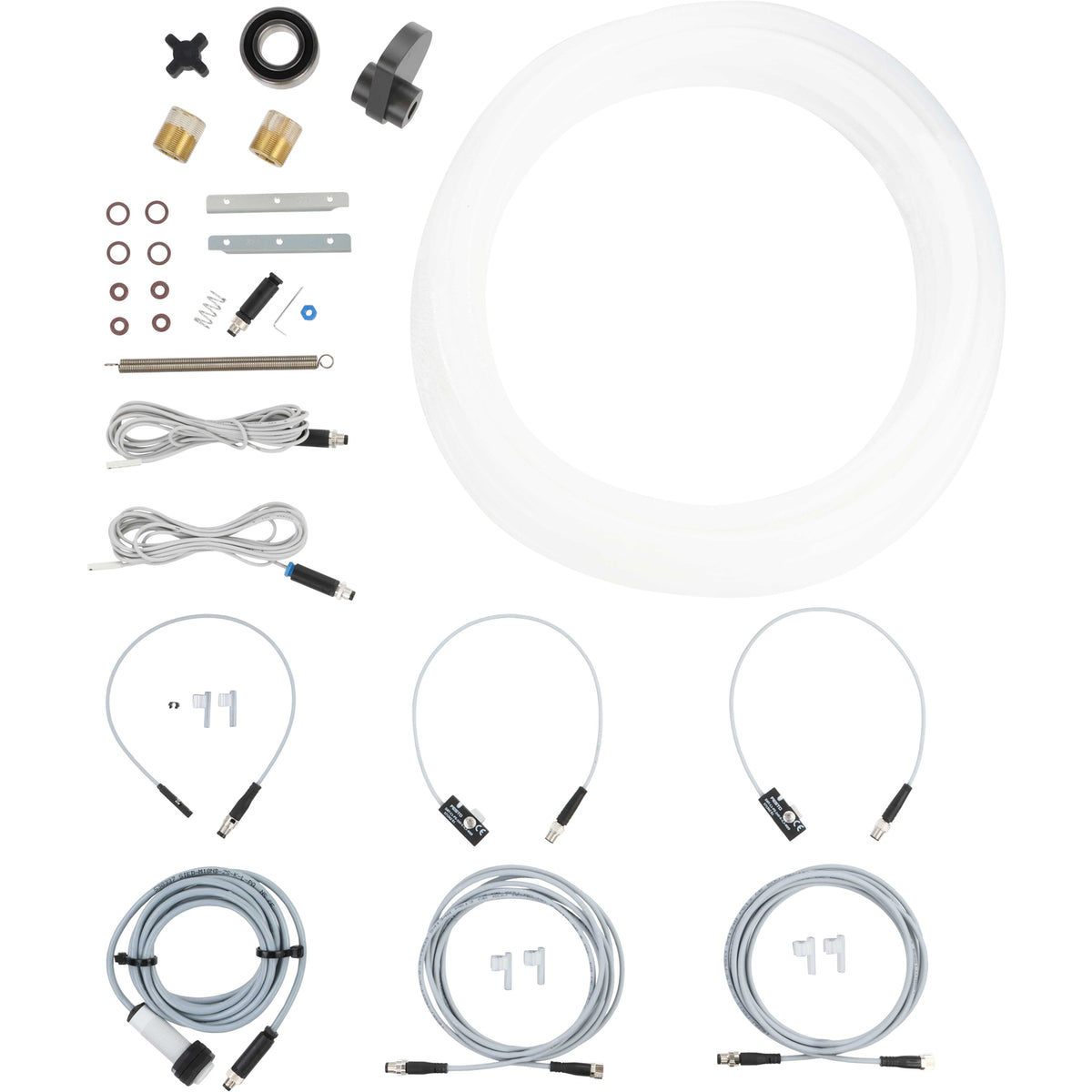 An assortment of parts that include sensor cables, o-rings, product tubing, springs, bearings and a rotary cam.  Parts shown on a white background. 